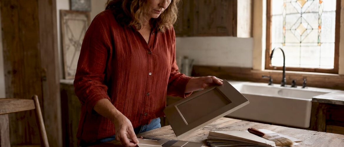 Woman choosing kitchen cabinet color samples