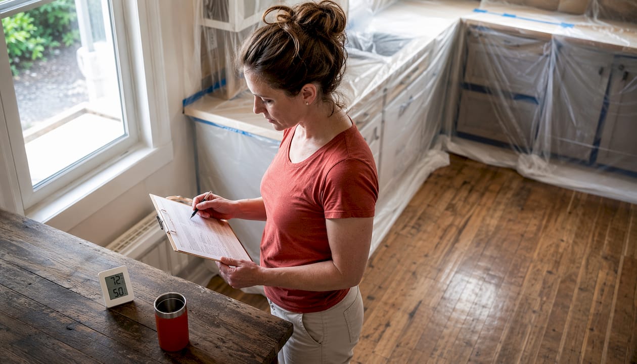 Woman monitoring paint room humidity