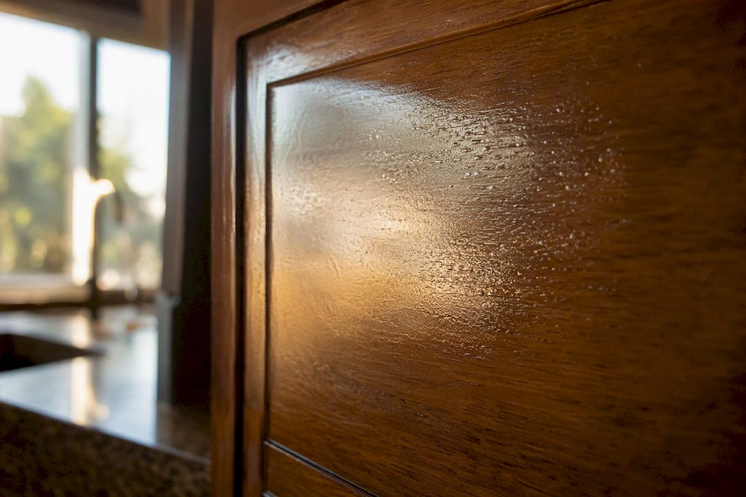 Close-up water-based finish on cabinet door surface