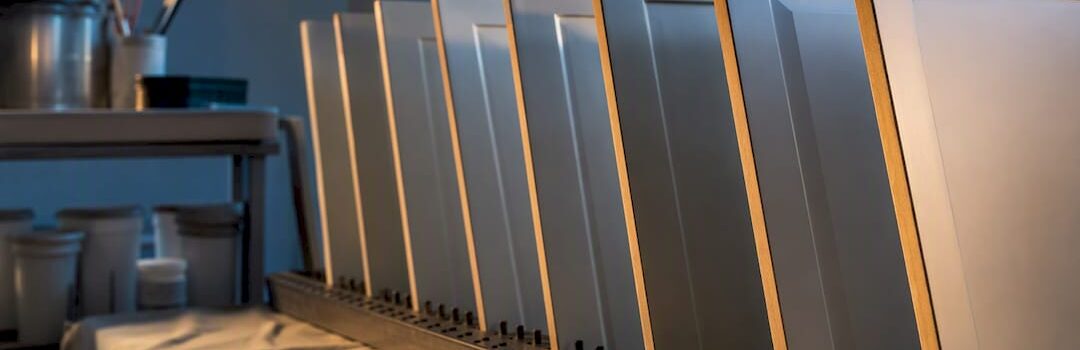 Cabinet doors curing on a drying rack