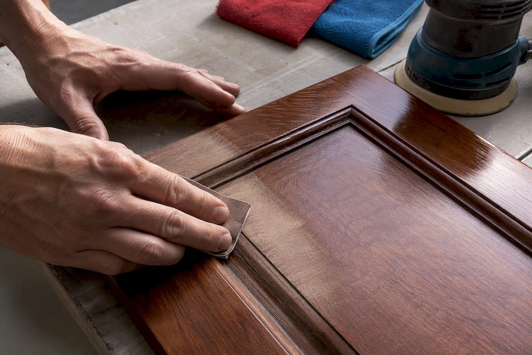 Scuff sanding a glossy cabinet profile