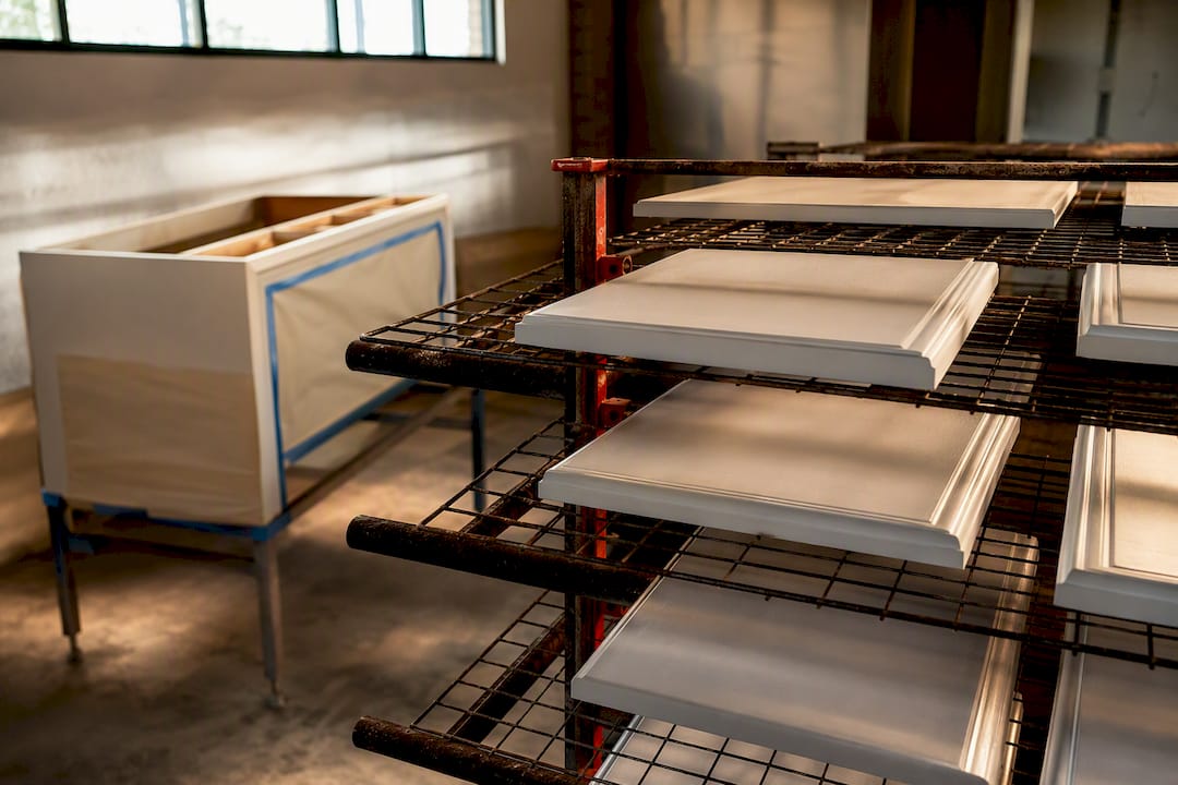 Cabinet doors curing beside prepared work area